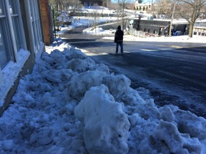 Is it fair to threaten property owners with a fine after public agency plows deposited snow boulders on their sidewalks? 